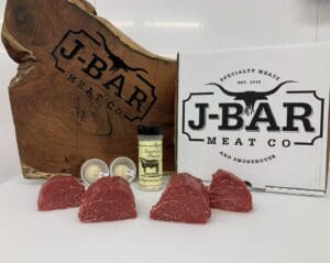 A box of raw meat sitting on top of a table.