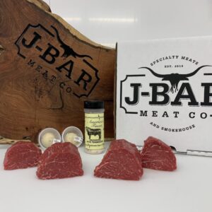 A box of raw meat sitting on top of a table.