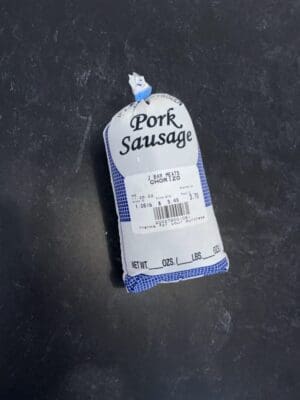 A bag of pork sausage sitting on top of a table.
