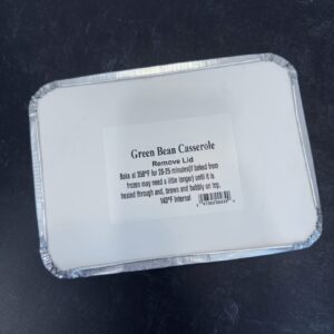 A plastic container with a white lid and some writing on it