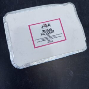 A white box with pink writing on it.