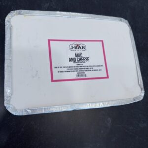 A white plastic container with a red label.