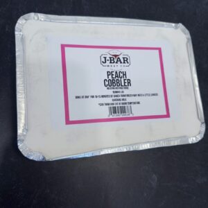 A white plate with some pink writing on it