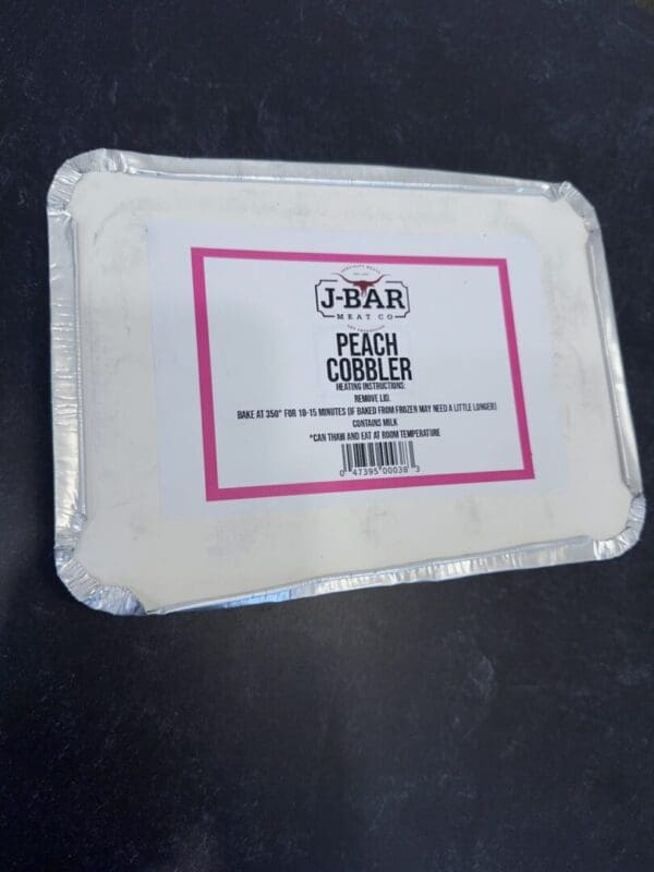 A white plate with some pink writing on it