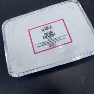 A plastic container with a pink and white label.
