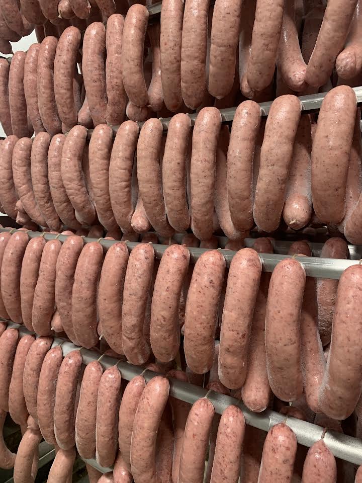 A bunch of sausages are stacked on top of each other